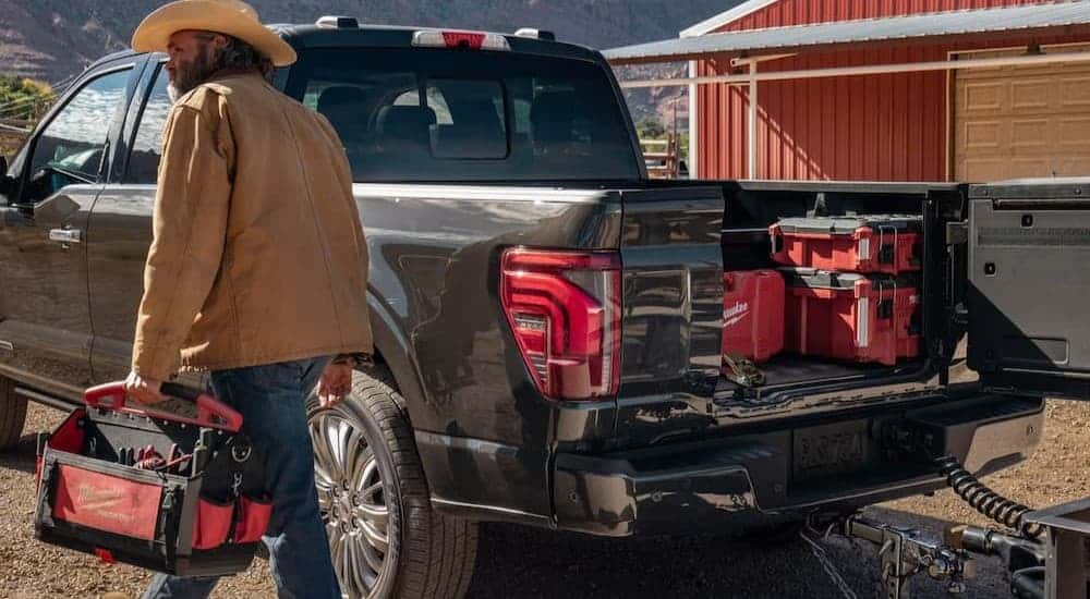 Open tailgate on a gray 2026 Ford F-150.