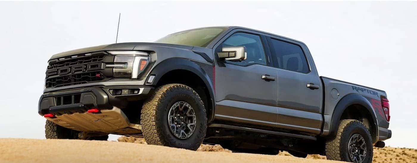 A gray 2026 Ford F-150 Raptor parked offroad.