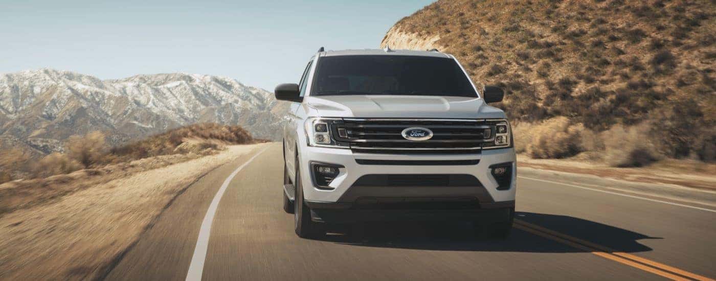 White 2022 Ford Expedition driving to a on an open road