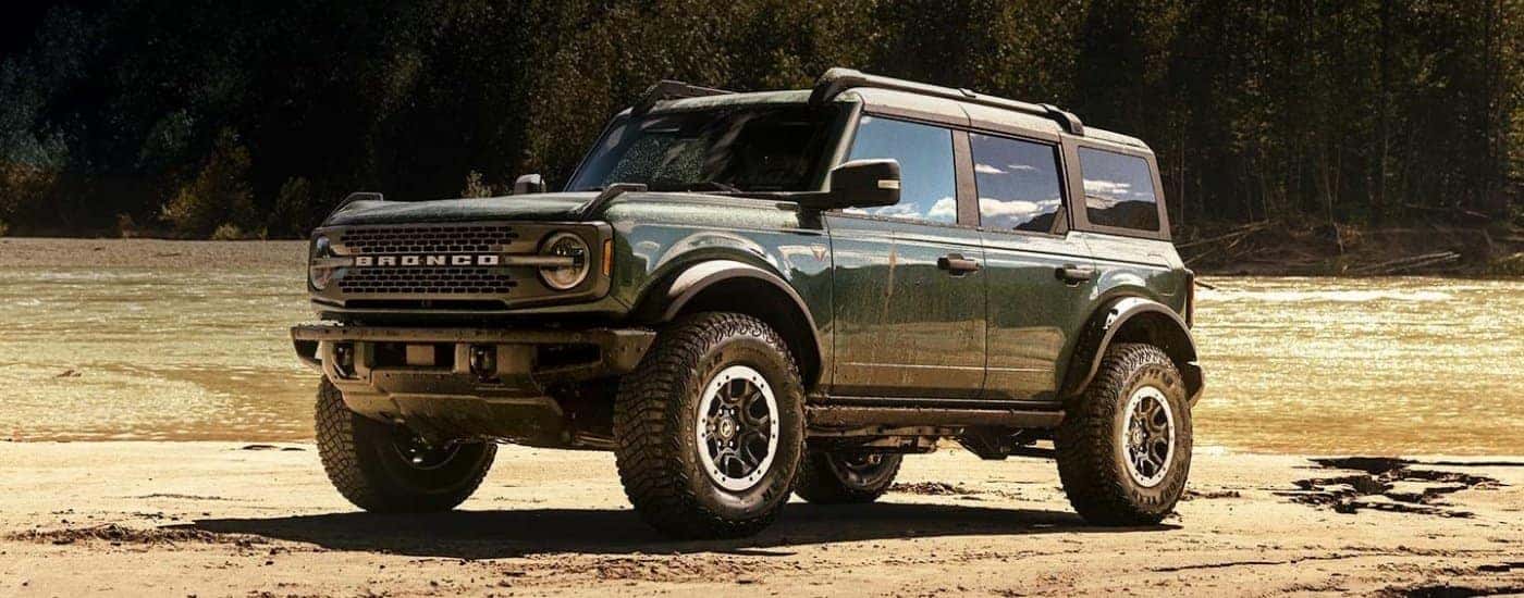 Green 2026 Ford Bronco parked off-road at an angle