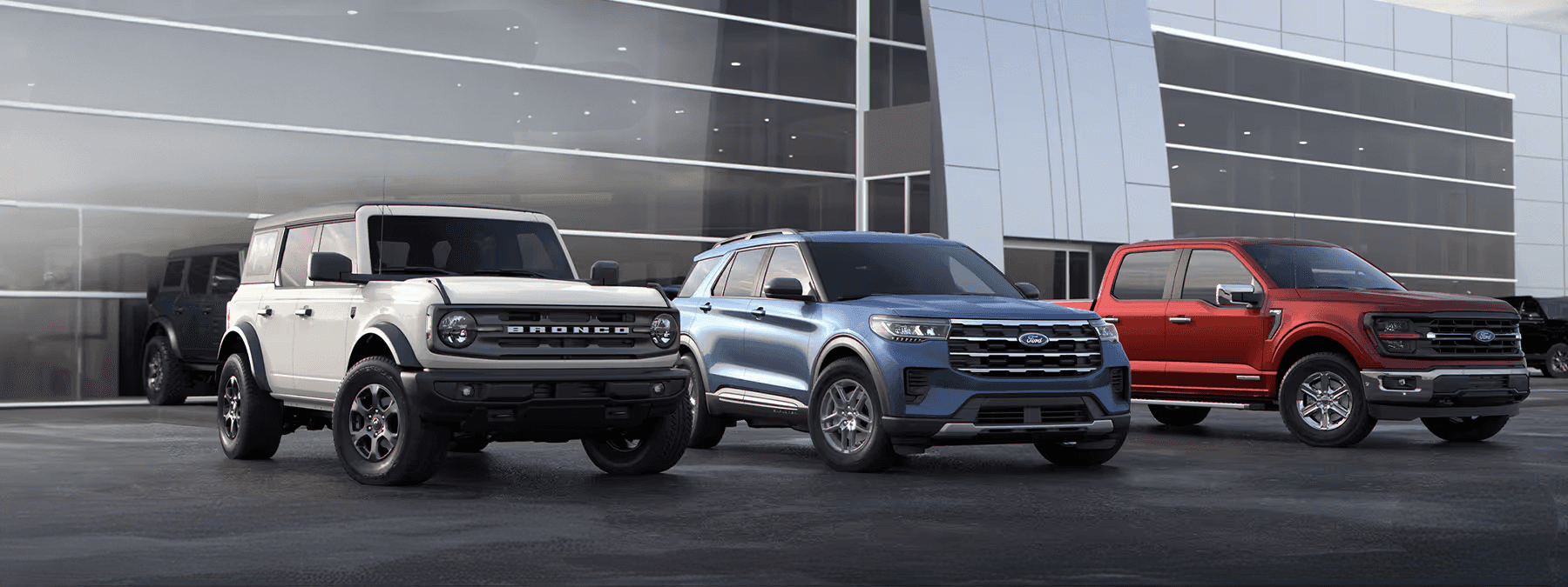 Two 2021 Ford F150 trucks in a mountain valley