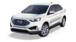 A white 2021 Ford Edge Titanium is angled left.