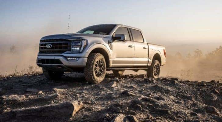 A silver 2022 Ford F-150 Tremor is shown on a rocky trail.