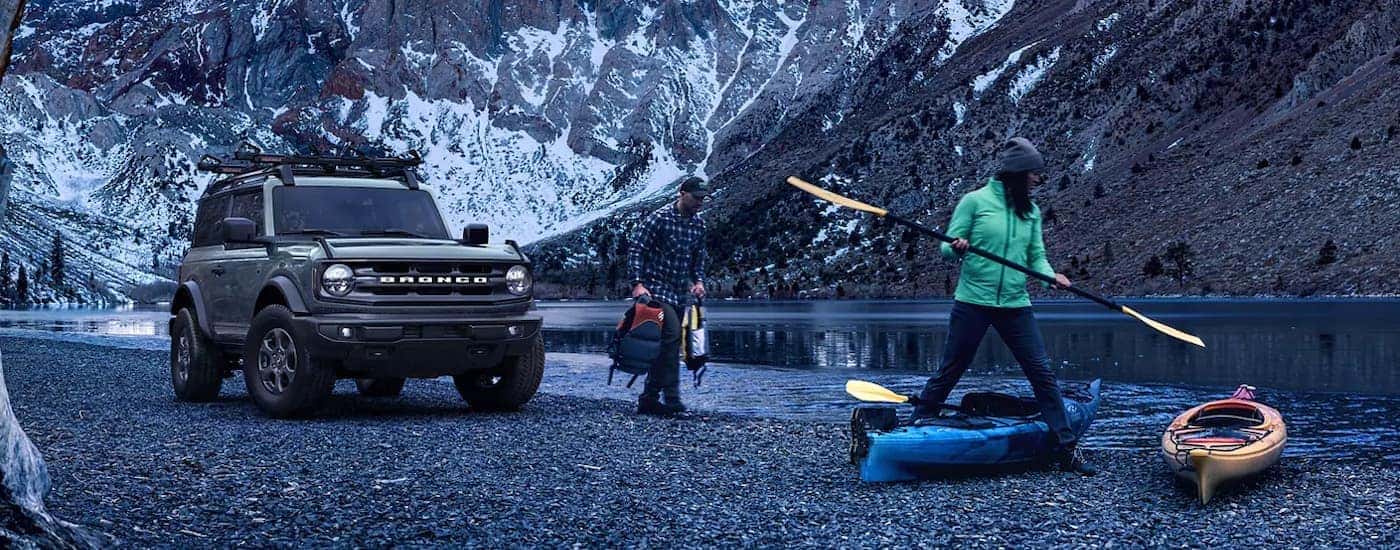 A grey 2021 Ford Bronco Big Bend is shown near people kayaking after visiting a Murfreesboro Ford dealer.