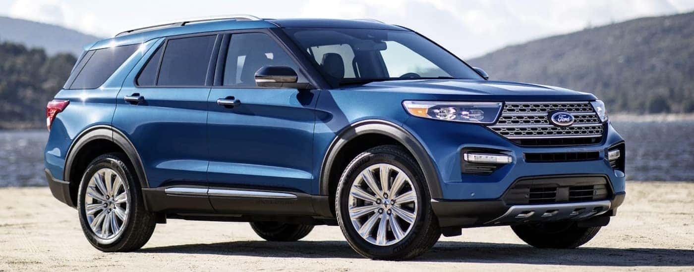 A blue 2022 Ford Explorer Hybrid is shown from the side after leaving a Nashville Hybrid dealer.