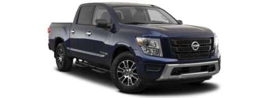 A dark blue 2022 Nissan Titan is shown angled right.