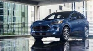 A blue 2022 Ford Escape is shown parked in a gallery.