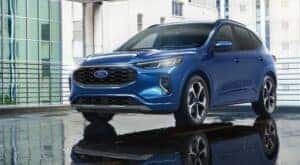 A popular Ford Escape in Shelbyville, a blue 2023 Ford Escape ST-Line Elite, is shown in a parking garage.