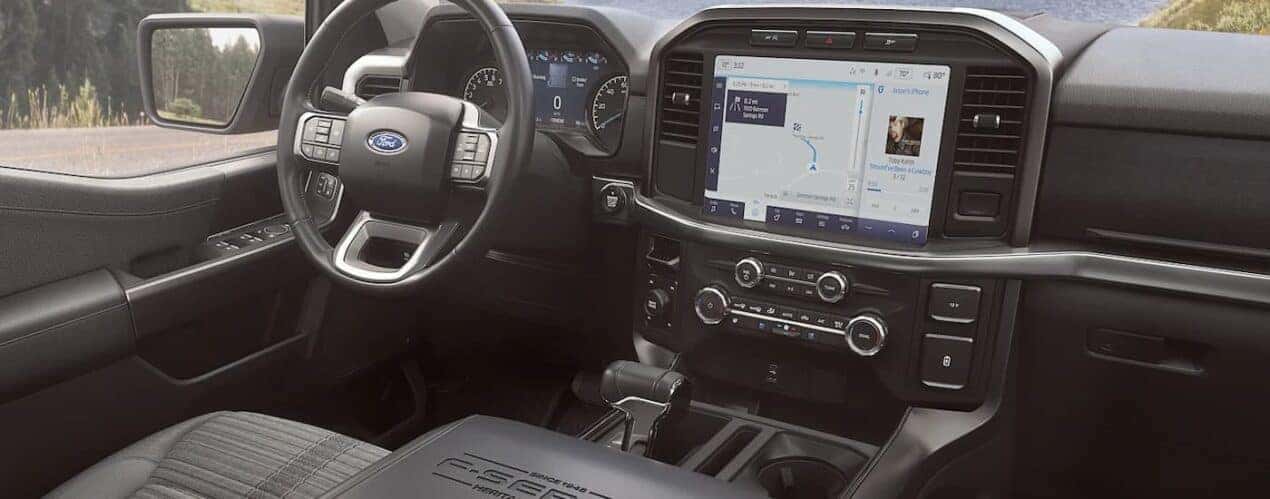 The interior of a 2023 F-150 Heritage Edition shows the steering wheel and center console.