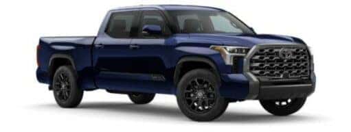 A blue 2023 Toyota Tundra Platinum is angled right.