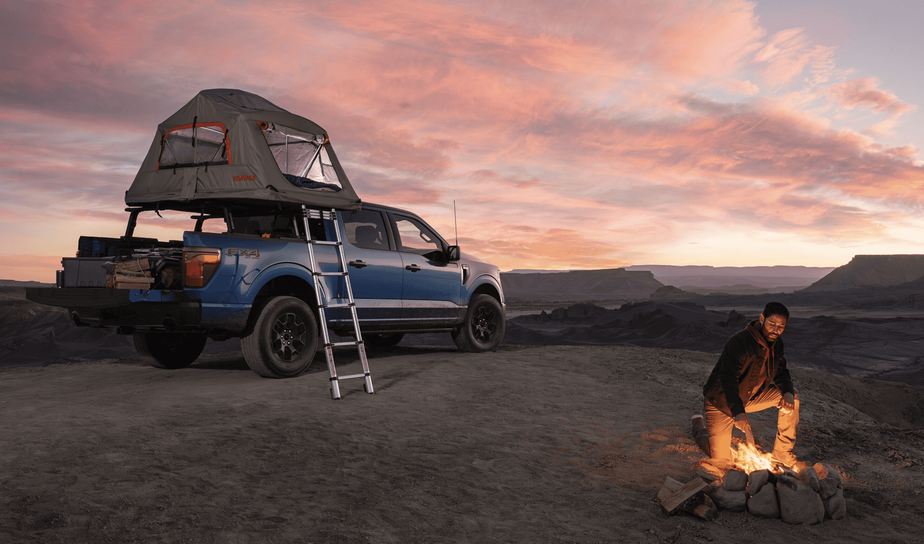 Person camping next to a 2024 F-150