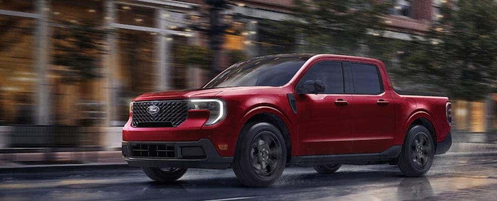 Red Ford Maverick Truck Driving in Rain