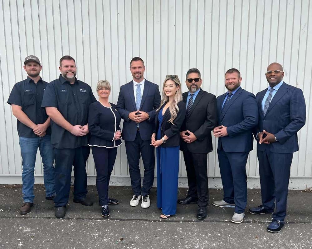 The Port Orchard Ford team in front of the dealership
