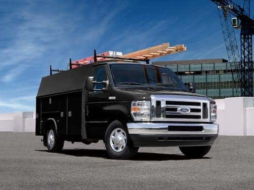 2025 Ford E-Series Cutaway exterior view of van parked outside a building on a sunny day
