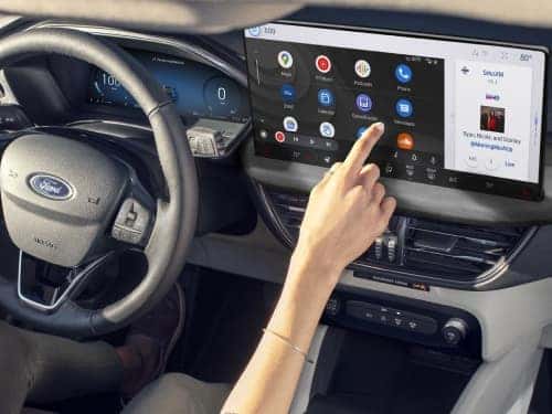 2024 Ford Escape view of woman using touchscreen display