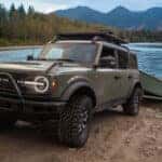 2026 Ford Bronco Holding a Boat in Front of a Lake