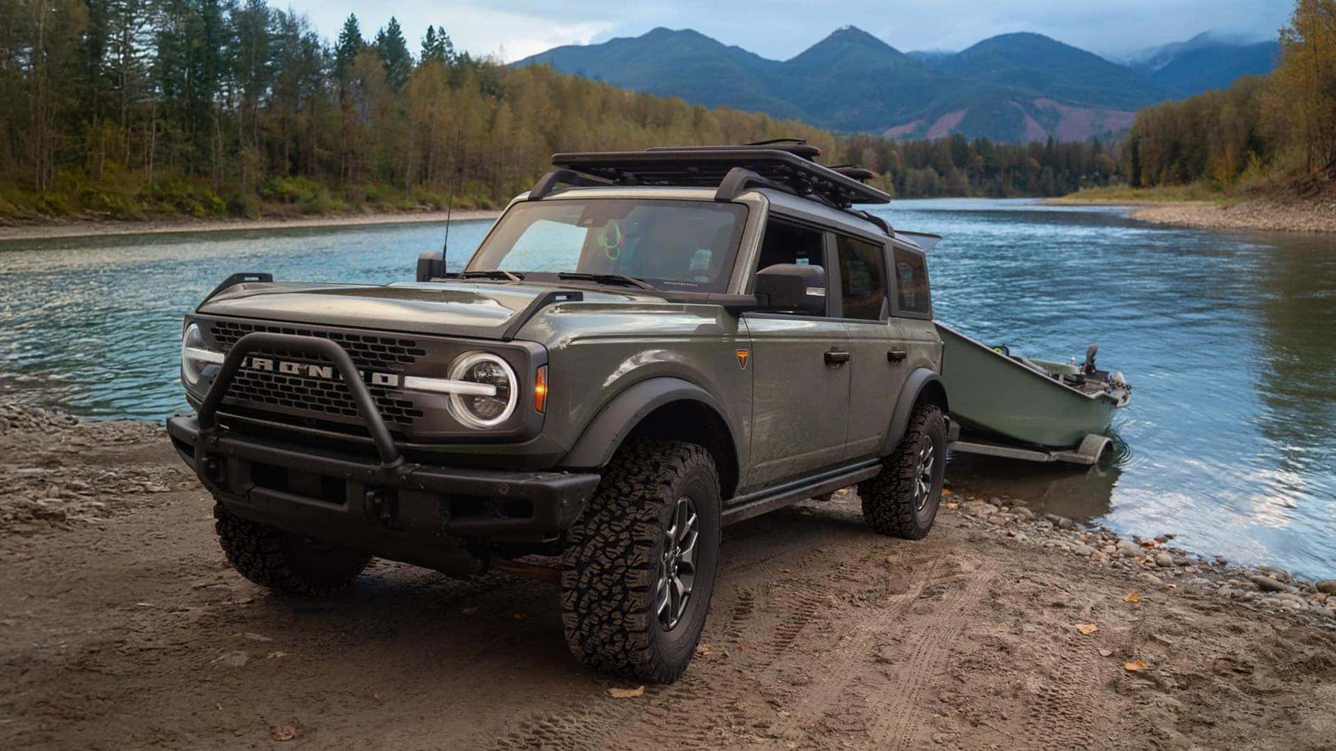 2026 Ford Bronco Holding a Boat in Front of a Lake