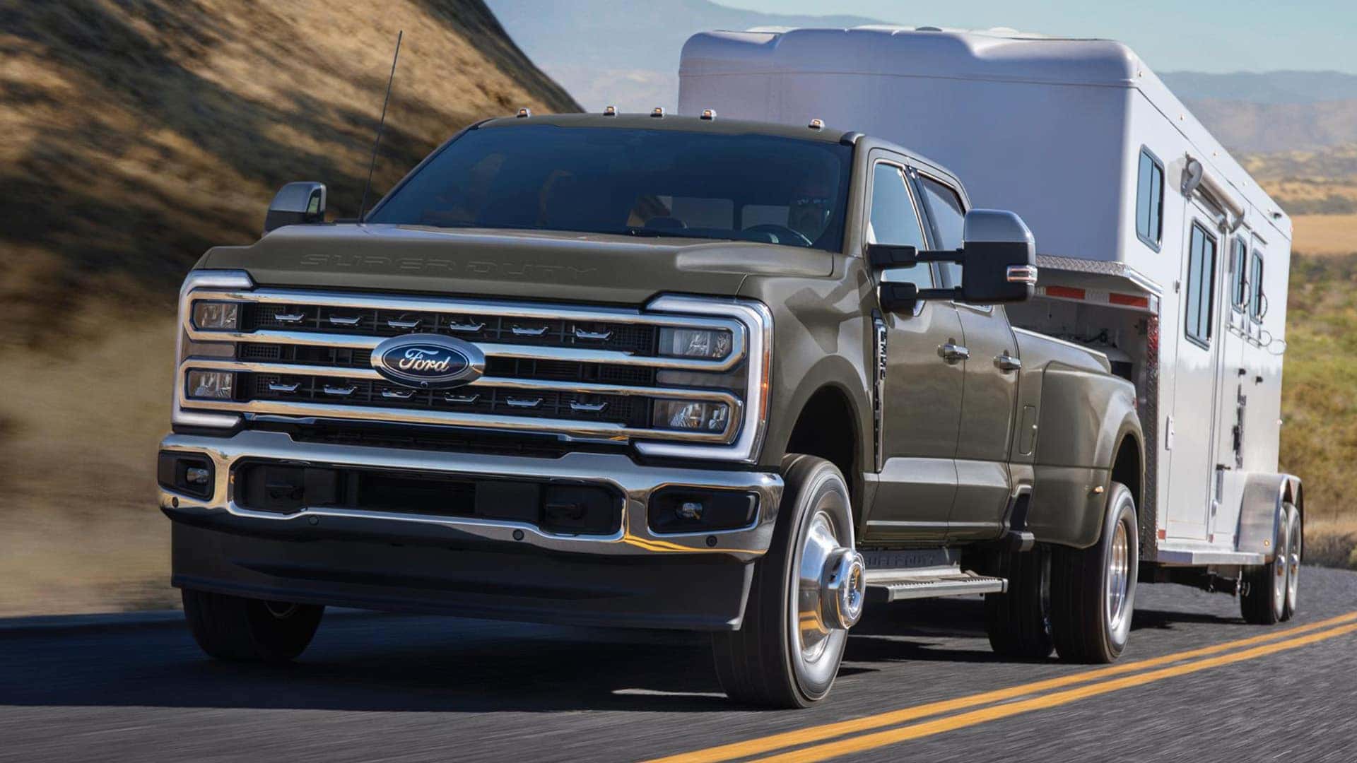 Brown 2026 Ford Super Duty Hauling an RV