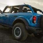 A blue 2021 Ford Bronco is shown from the side after leaving a Louisville Ford Bronco dealer.