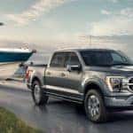 Grey 2021 Ford F-150 hauling a boat_mobile