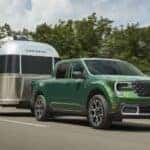 Eruption Green Metallic Ford Maverick towing trailer 2025