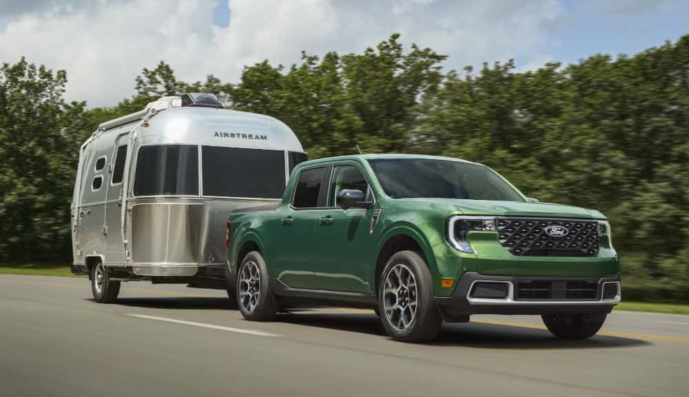 Eruption Green Metallic Ford Maverick towing trailer 2025