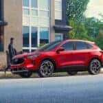 Side view of red ford escape parked on street