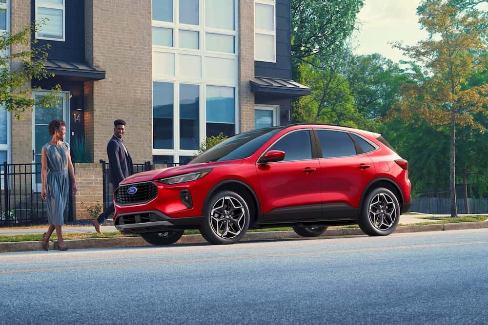 Side view of red ford escape parked on street